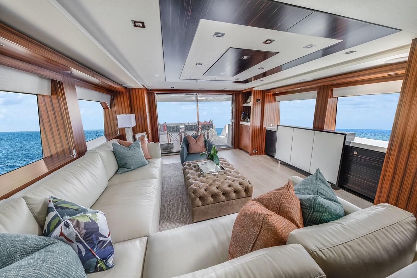 a living room with a large window aboard LATITUDES Yacht for Sale