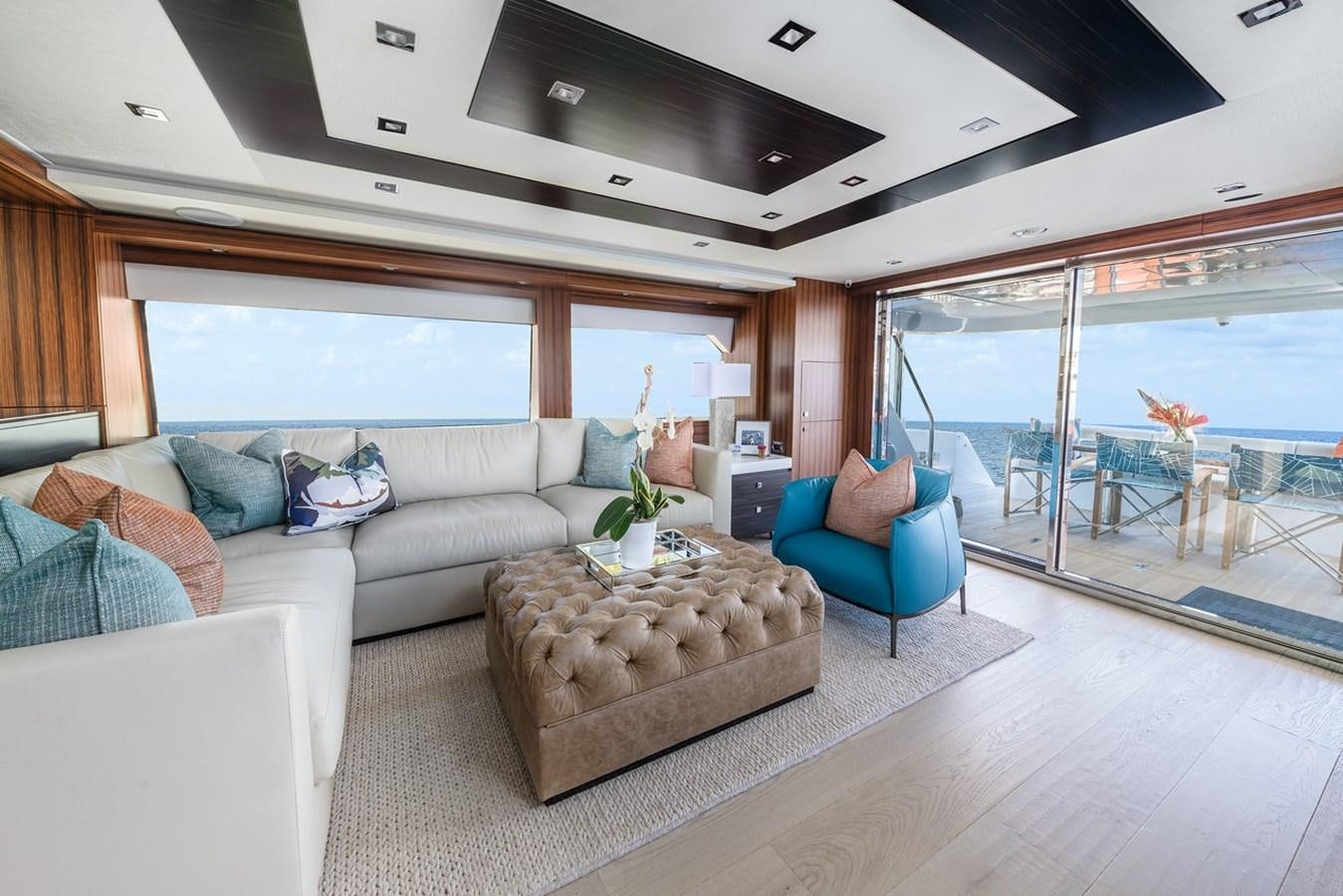 a living room with a large window aboard LATITUDES Yacht for Sale