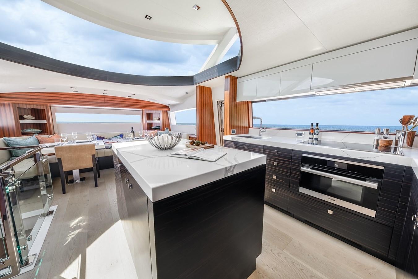 a kitchen with a large island aboard LATITUDES Yacht for Sale
