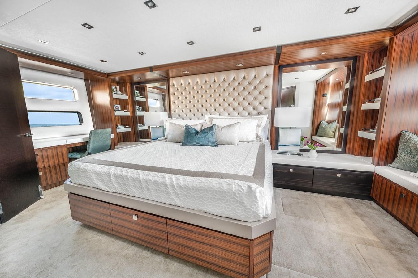 a bedroom with a large bed aboard LATITUDES Yacht for Sale
