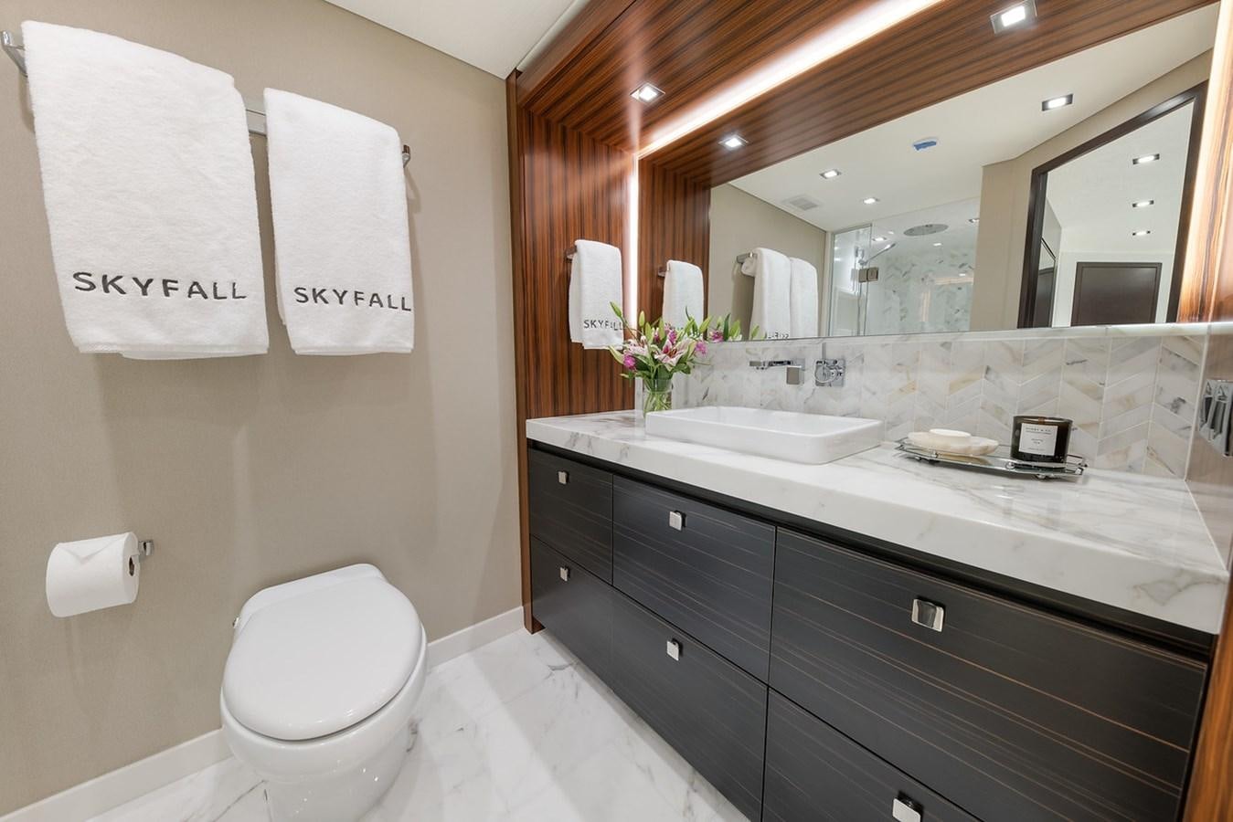 a bathroom with a large mirror aboard LATITUDES Yacht for Sale