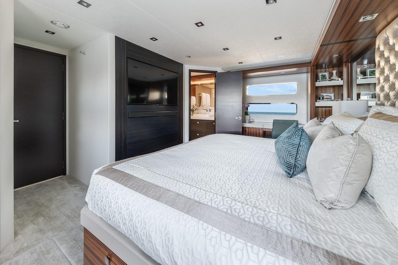 a large bed in a room aboard LATITUDES Yacht for Sale