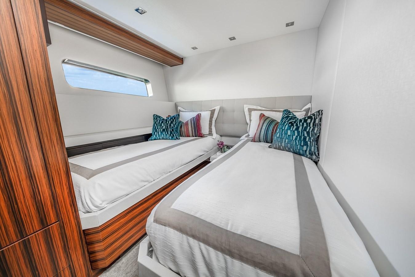 a couple of beds in a room aboard LATITUDES Yacht for Sale