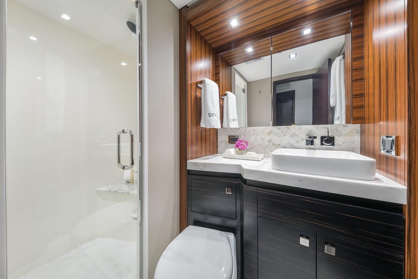 a bathroom with a large mirror aboard LATITUDES Yacht for Sale