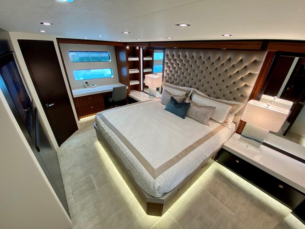 a large bed in a room aboard LATITUDES Yacht for Sale