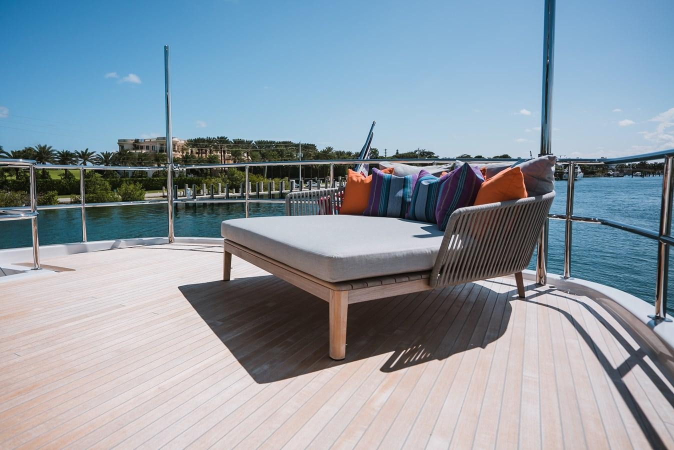 a couch on a deck aboard LATITUDES Yacht for Sale