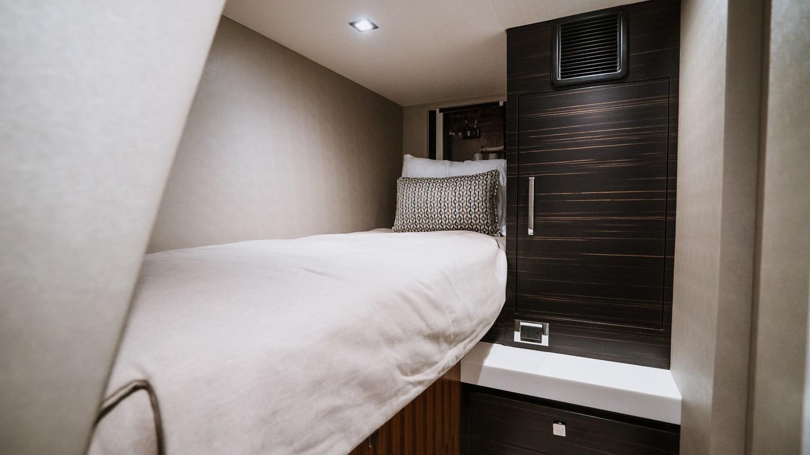 a bed in a room aboard LATITUDES Yacht for Sale