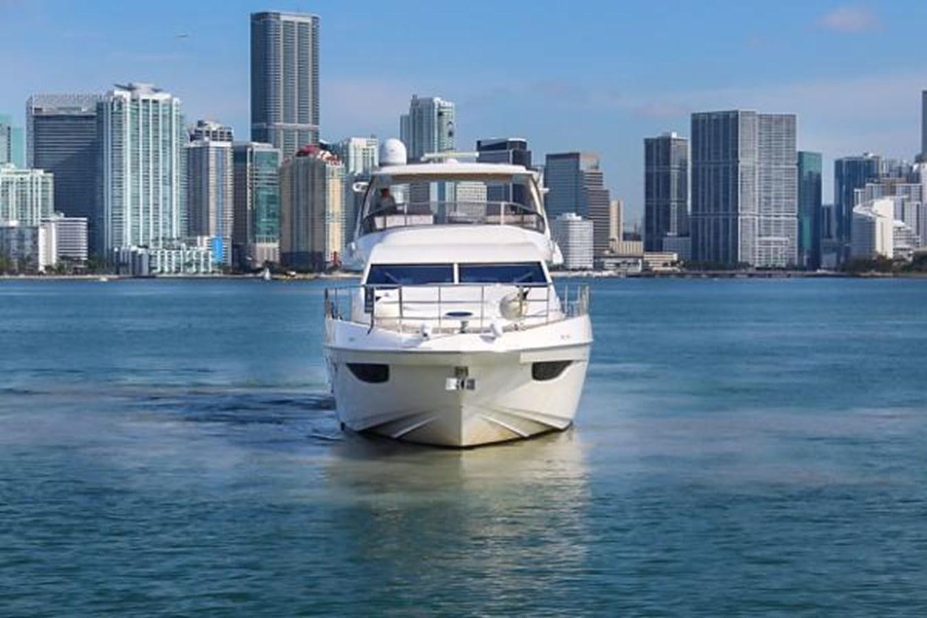 a white boat in the water aboard 70 Yacht for Sale