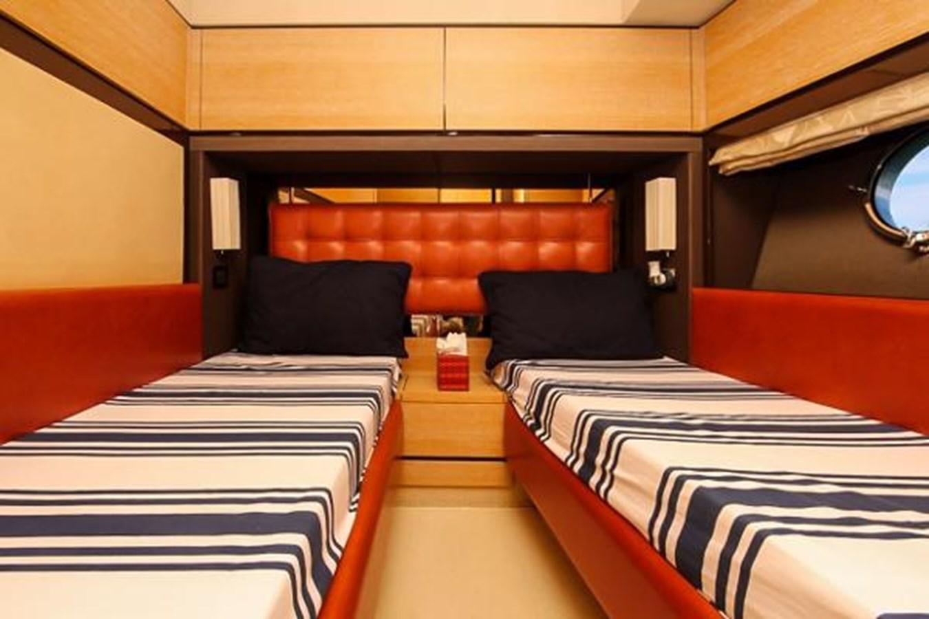 a room with beds and a window aboard 70 Yacht for Sale