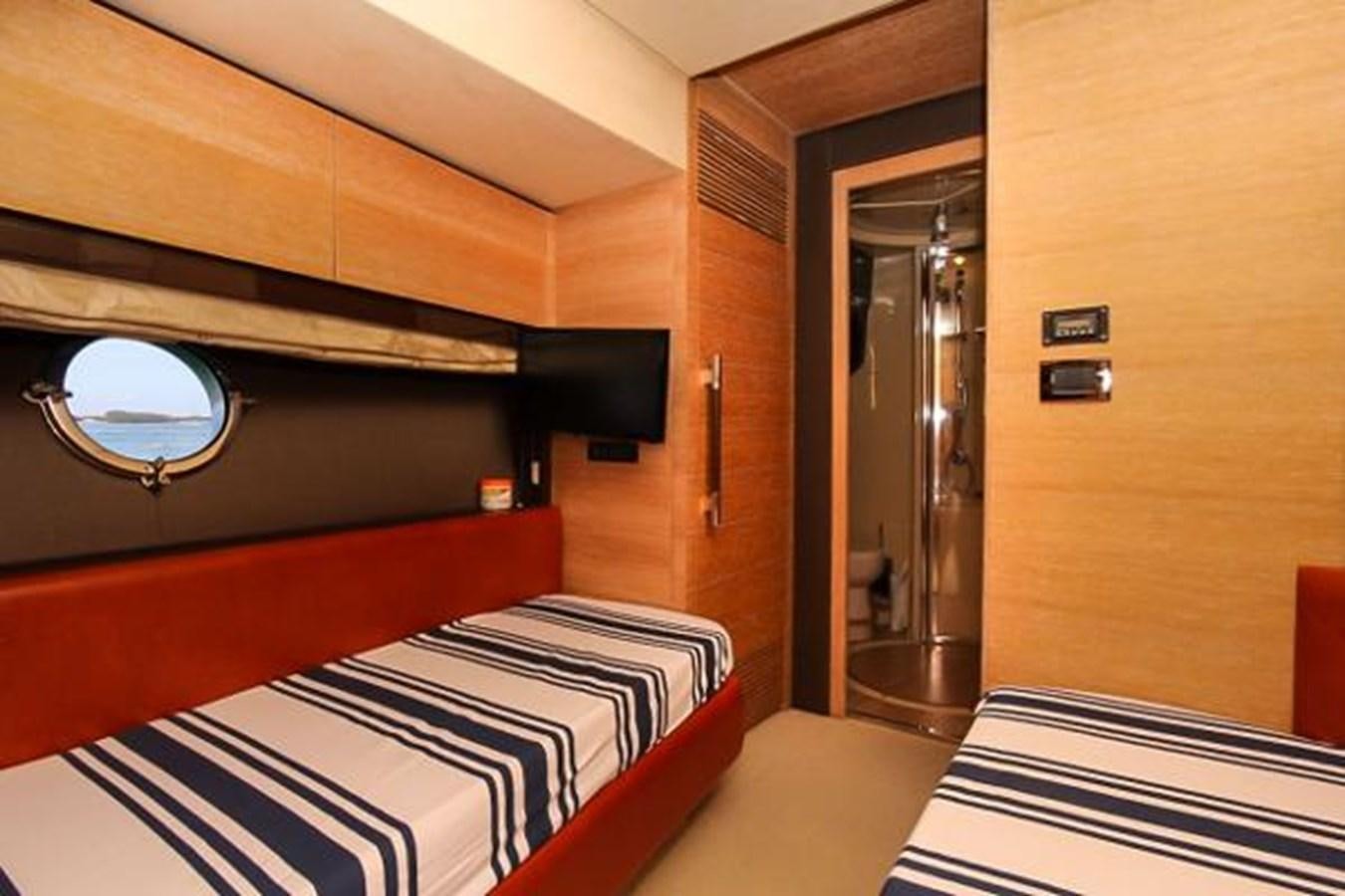 a room with a bed and a mirror aboard 70 Yacht for Sale