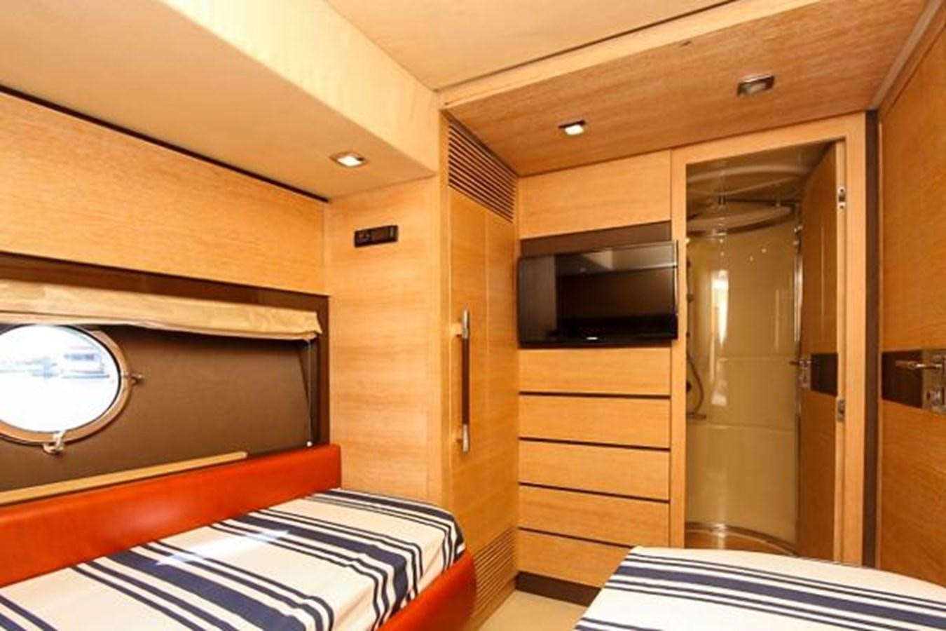 a room with a bed and a closet aboard 70 Yacht for Sale