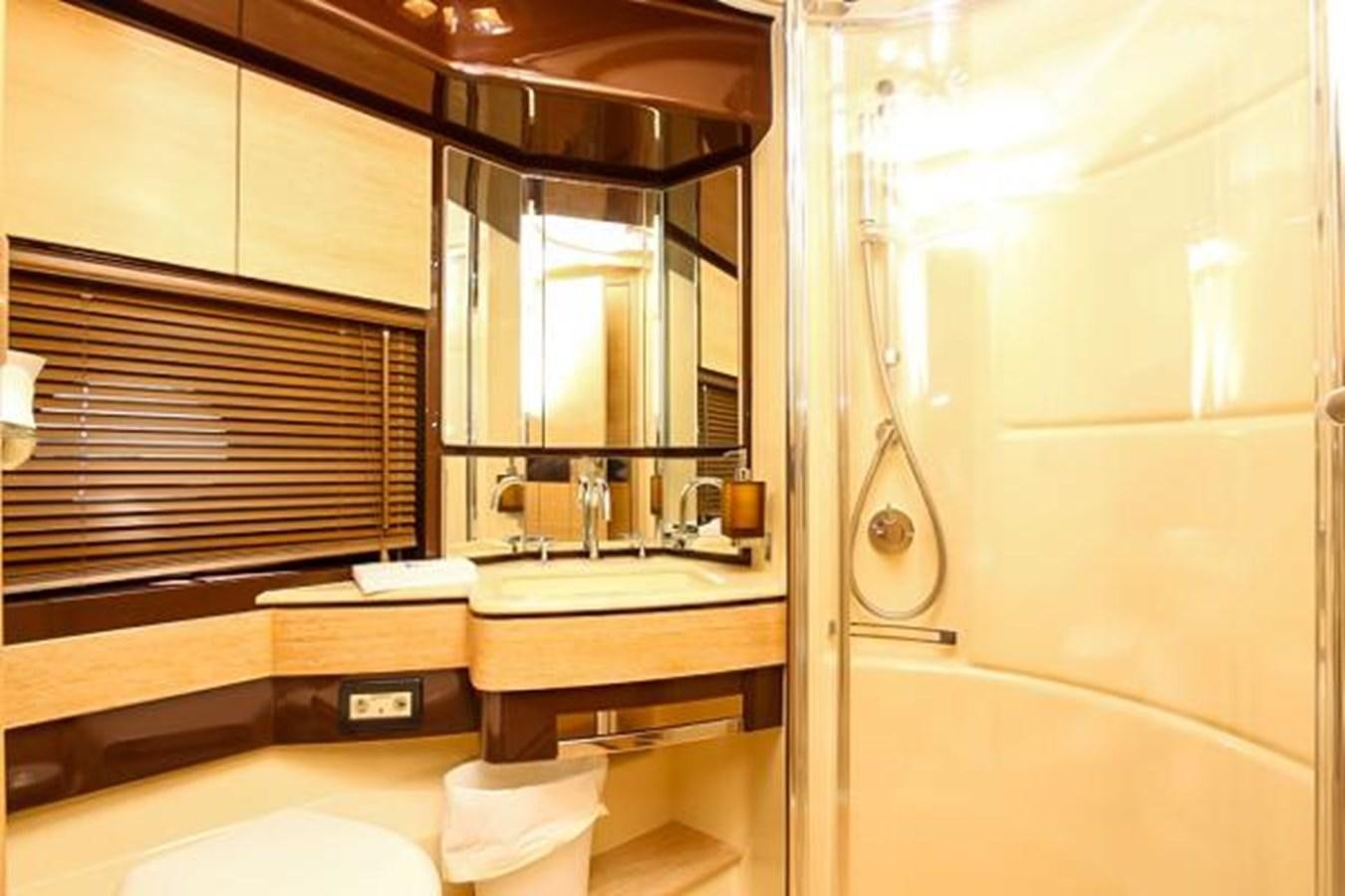 a bathroom with a sink and a mirror aboard 70 Yacht for Sale
