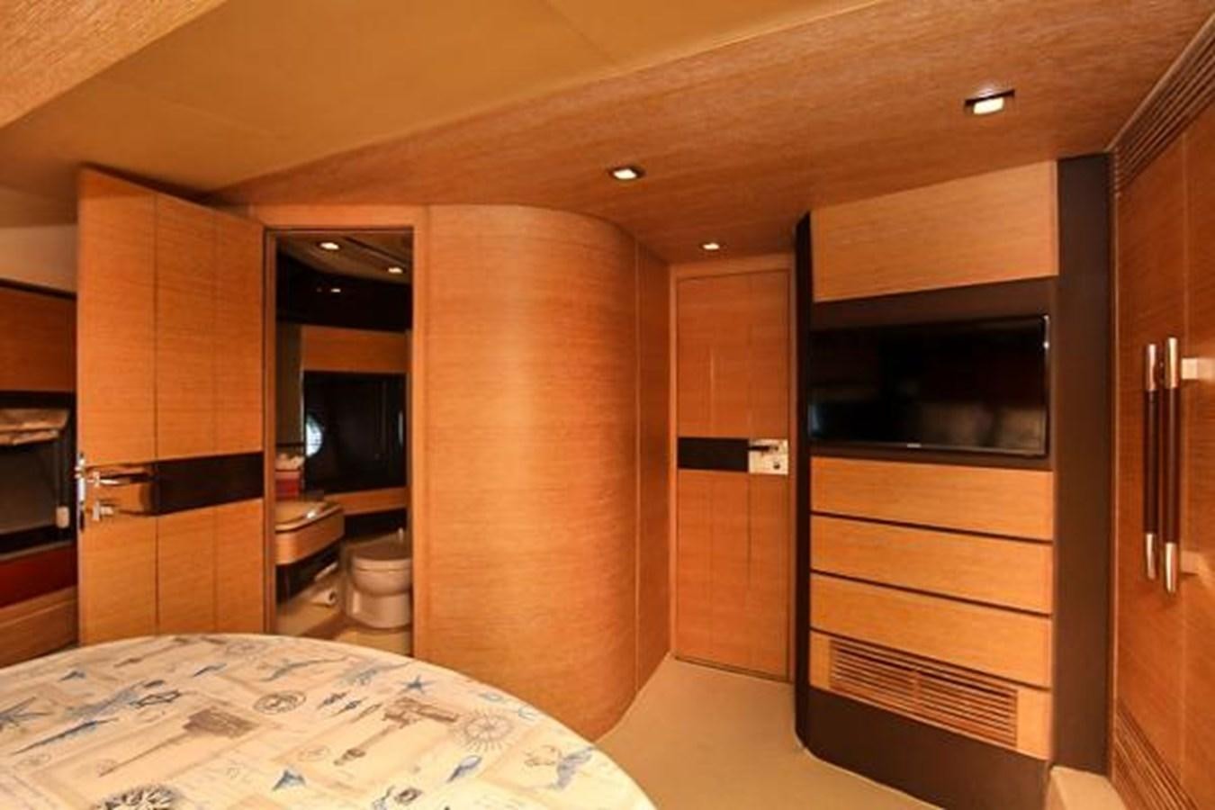a bathroom with a bed and a large closet aboard 70 Yacht for Sale