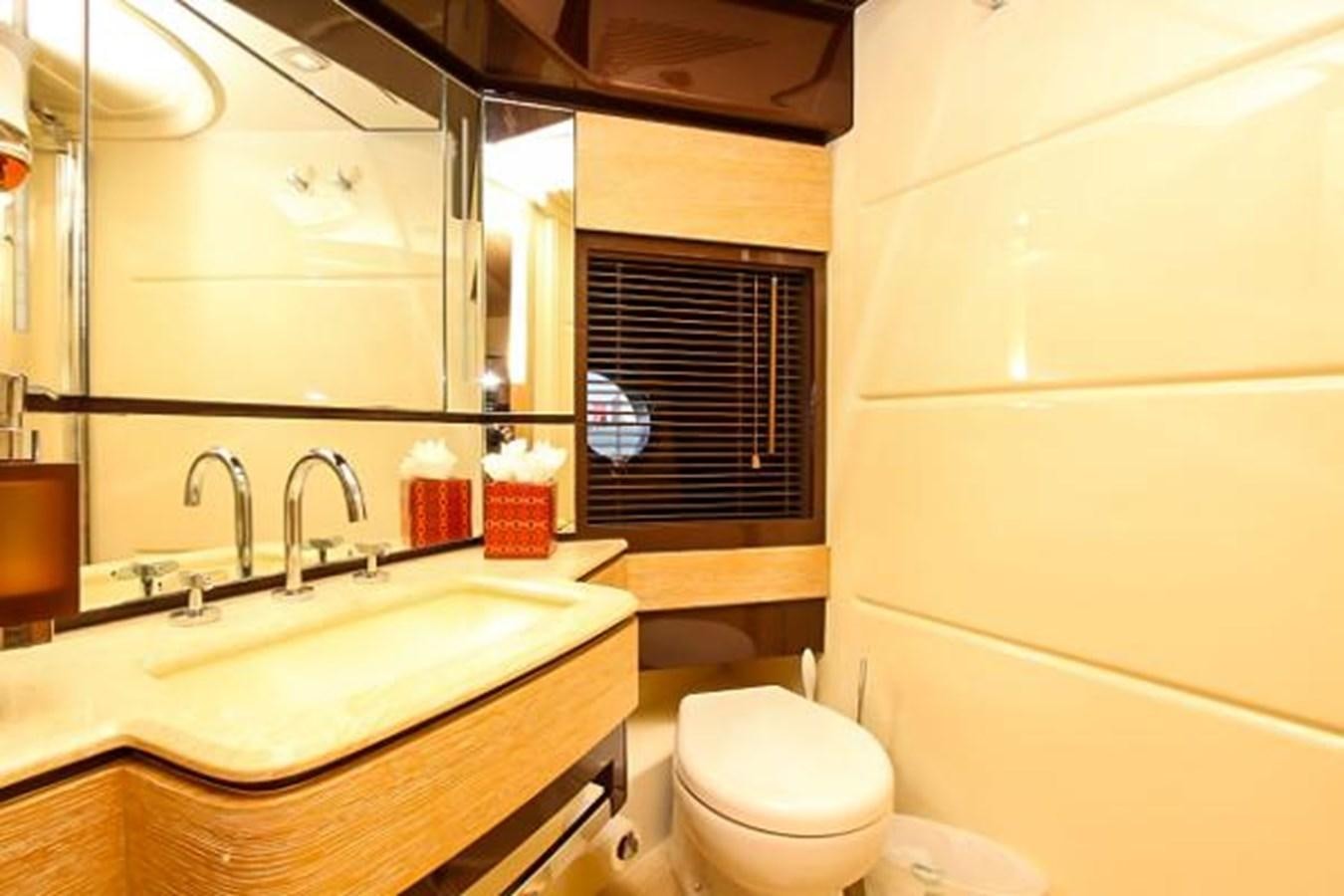 a bathroom with a sink and toilet aboard 70 Yacht for Sale