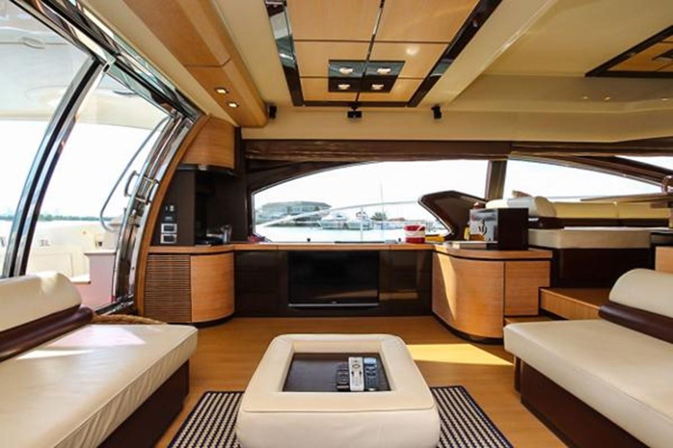 inside of a vehicle with a laptop on a table aboard 70 Yacht for Sale