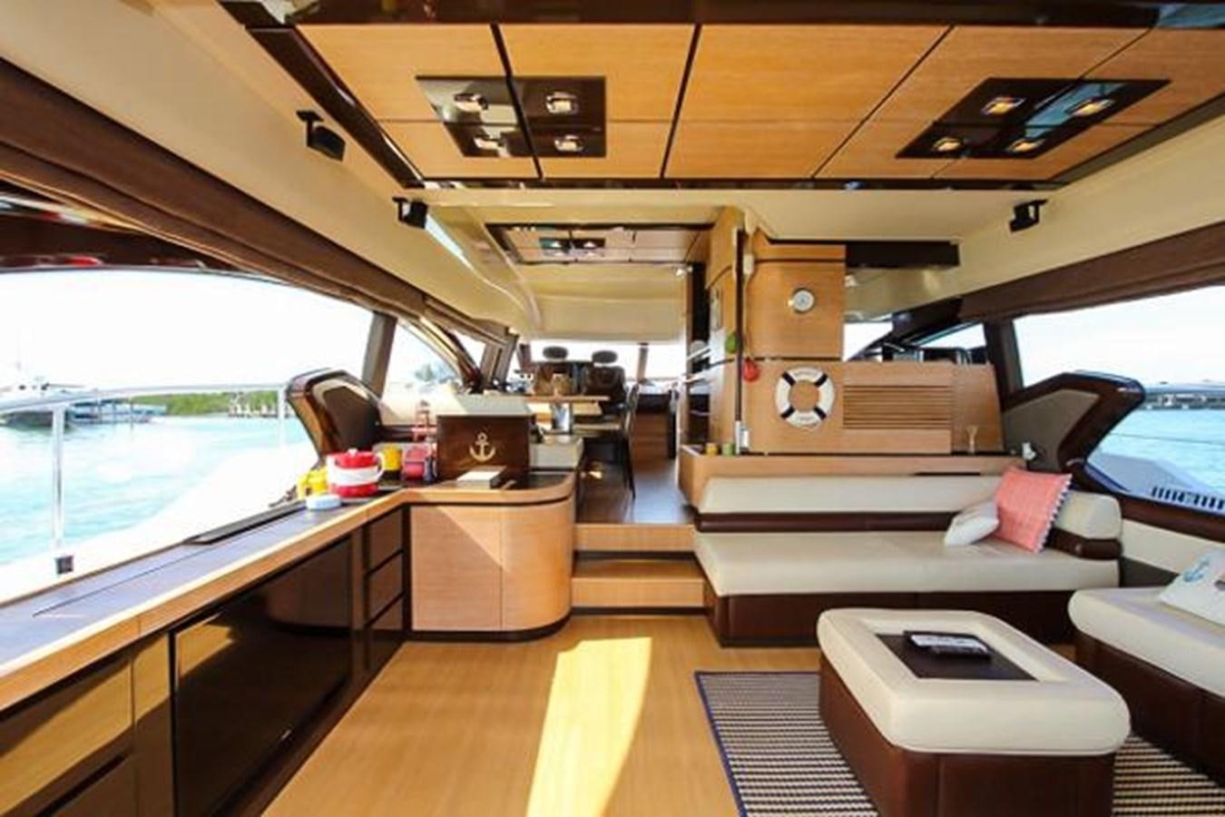 inside of a vehicle with a bed and desk aboard 70 Yacht for Sale