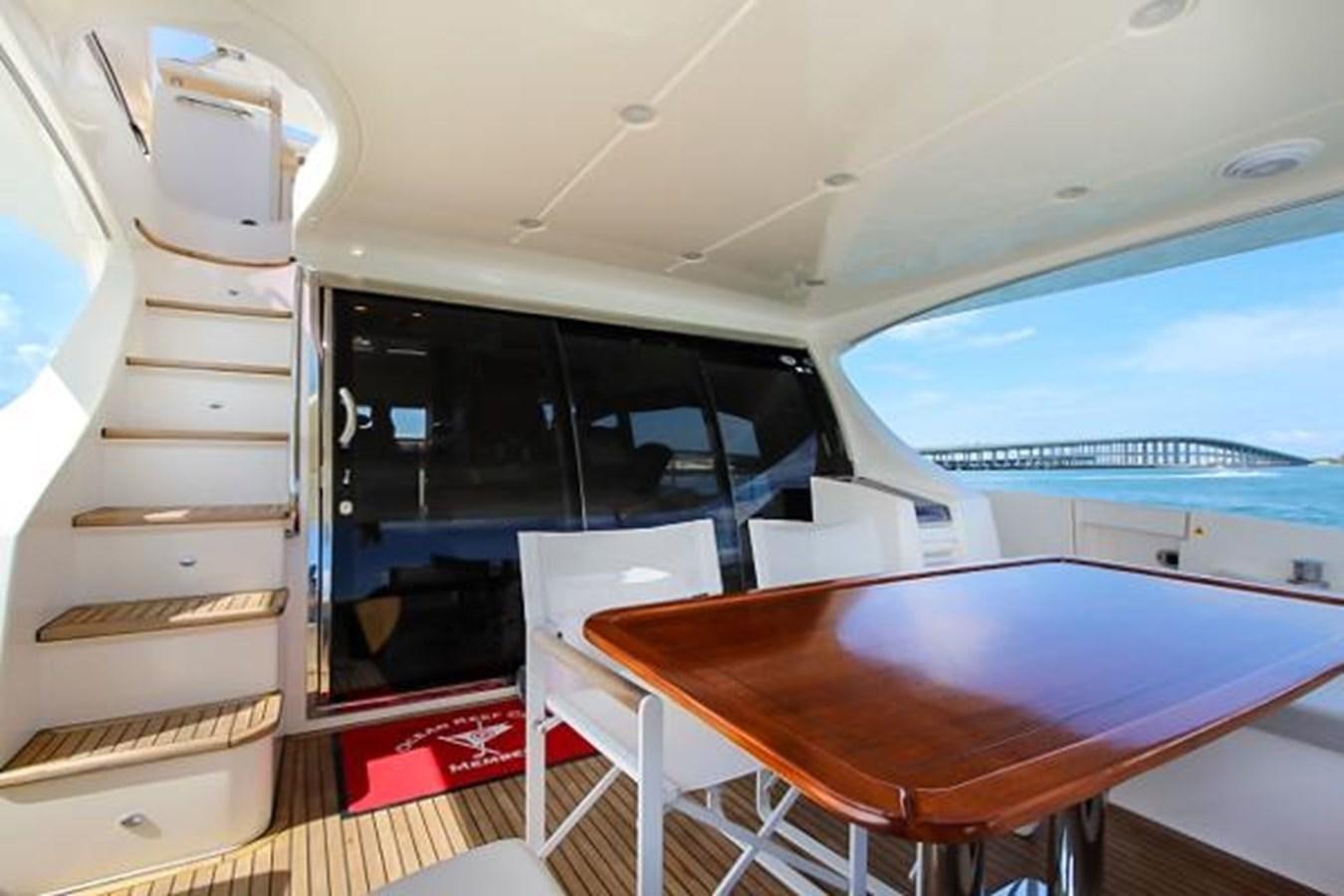 a room with a table and chairs aboard 70 Yacht for Sale