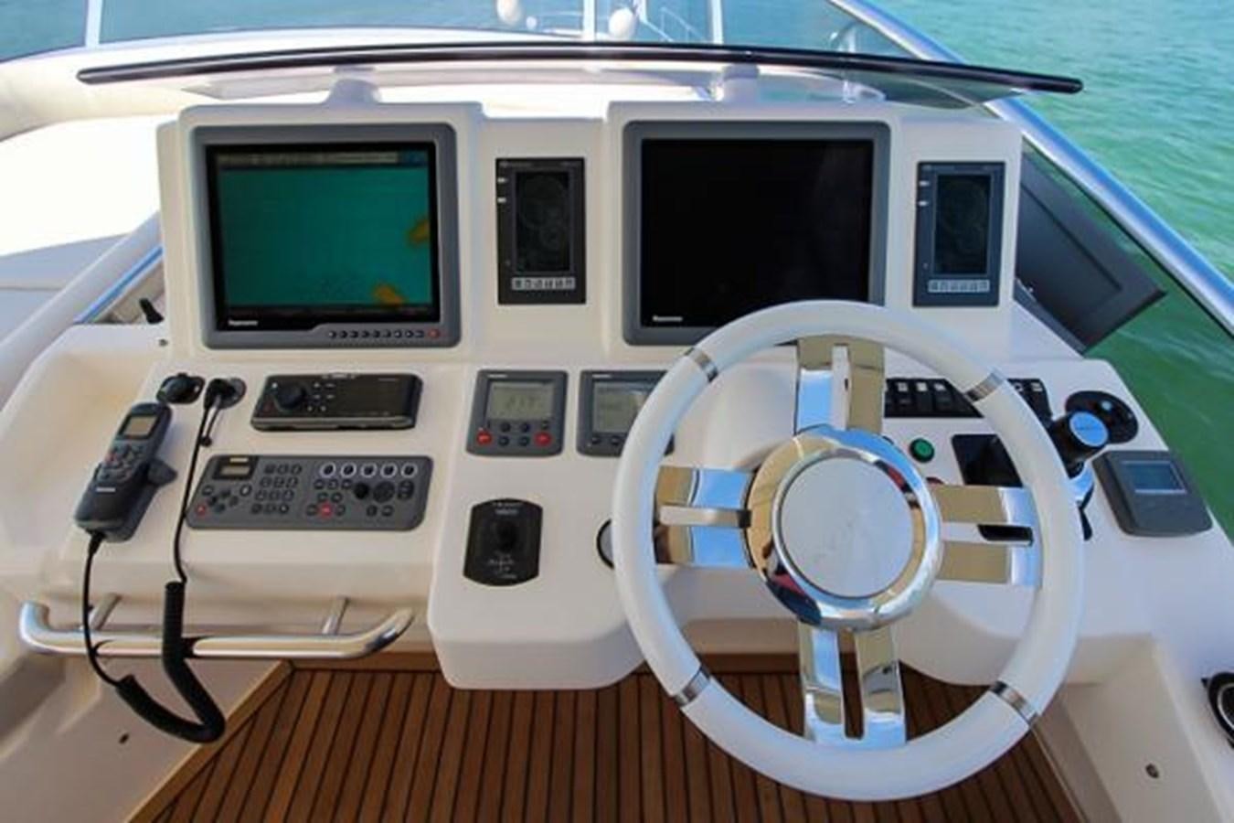 a white electronic device with a screen aboard 70 Yacht for Sale