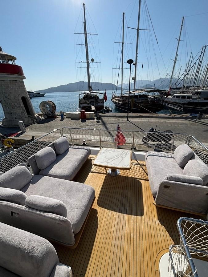 a deck with a deck and a group of boats in it aboard ATLANTIS OF LONDON Yacht for Sale