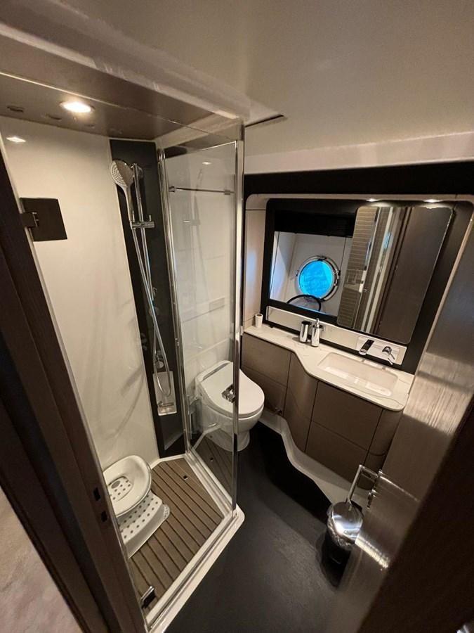 a bathroom with a large mirror aboard ATLANTIS OF LONDON Yacht for Sale