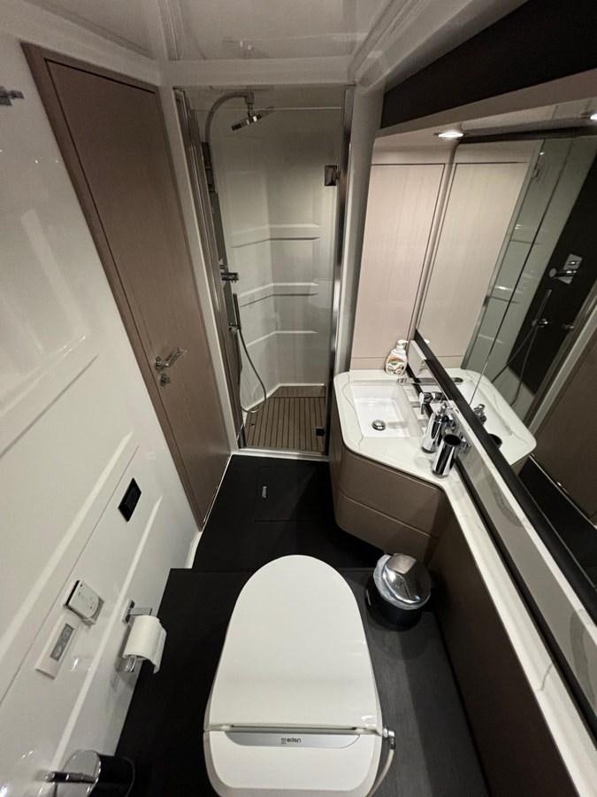 a bathroom with a toilet and a sink aboard ATLANTIS OF LONDON Yacht for Sale