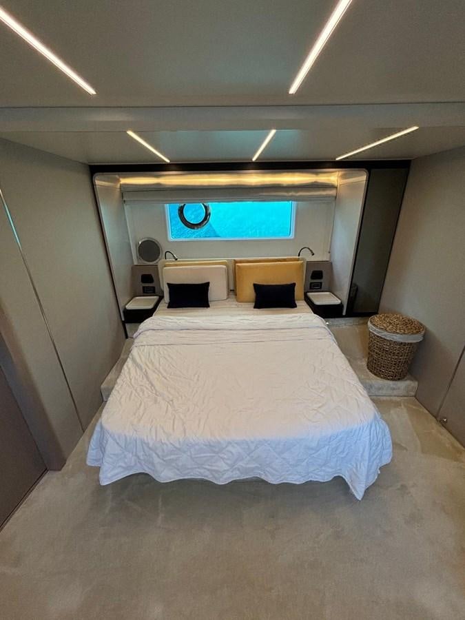 a bed in a room aboard ATLANTIS OF LONDON Yacht for Sale