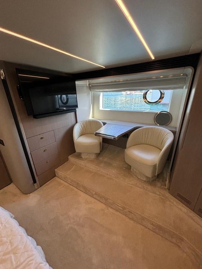 a small kitchen with a large window aboard ATLANTIS OF LONDON Yacht for Sale