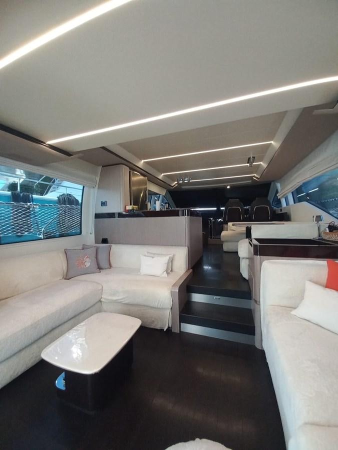 a room with couches and a table aboard ATLANTIS OF LONDON Yacht for Sale