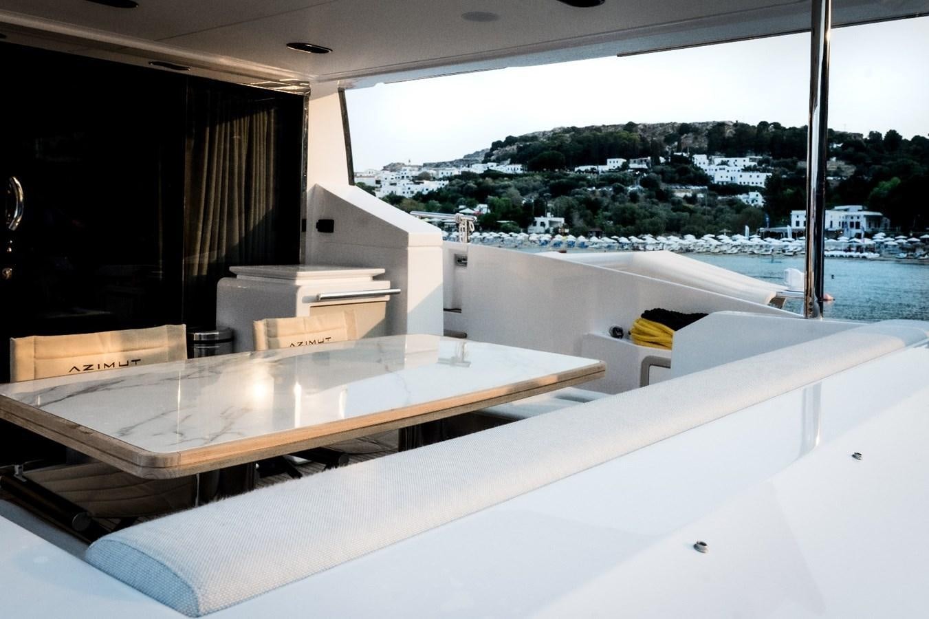 a room with a large window and a view of a city aboard ATLANTIS OF LONDON Yacht for Sale