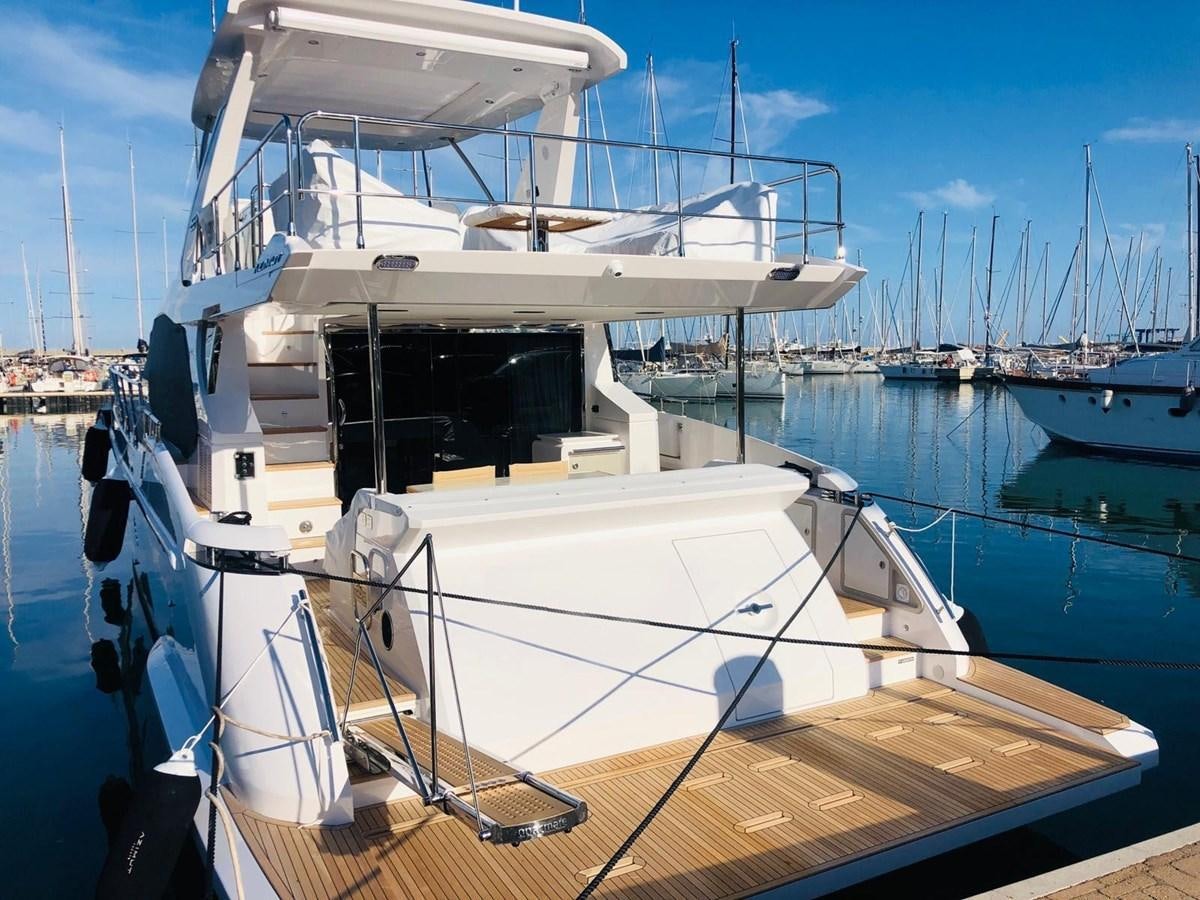 a boat docked at a pier aboard ATLANTIS OF LONDON Yacht for Sale