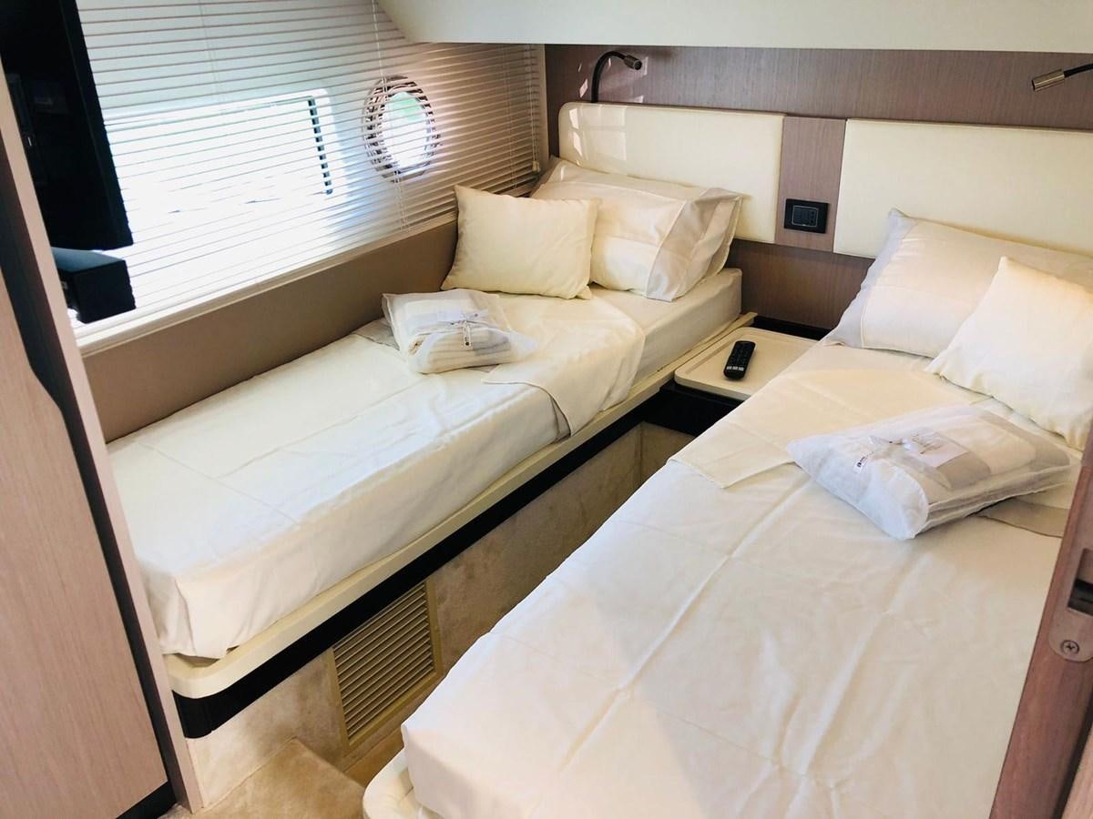 a couple of beds in a room aboard ATLANTIS OF LONDON Yacht for Sale