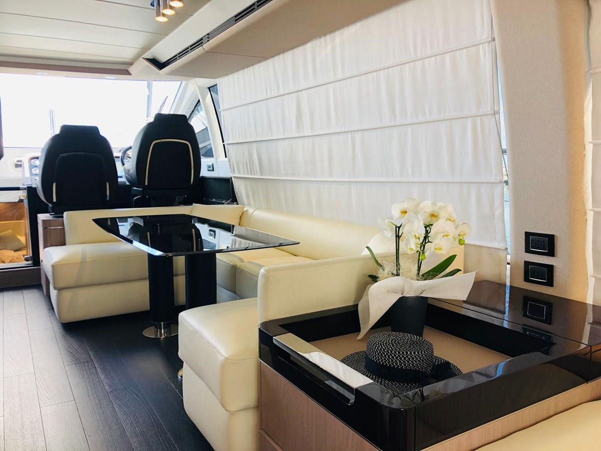 a room with a table and chairs aboard ATLANTIS OF LONDON Yacht for Sale