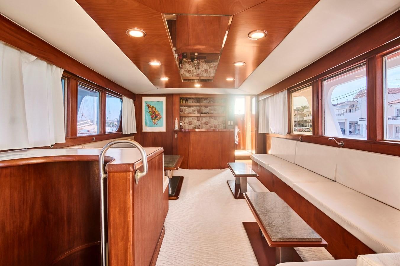 a room with a couch and a table aboard PRINCESS SOFIA Yacht for Sale