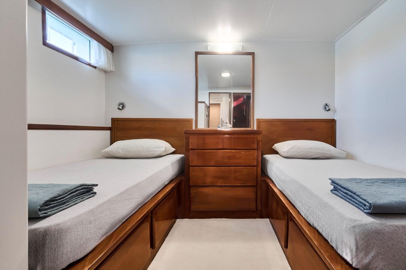 a room with two beds aboard PRINCESS SOFIA Yacht for Sale