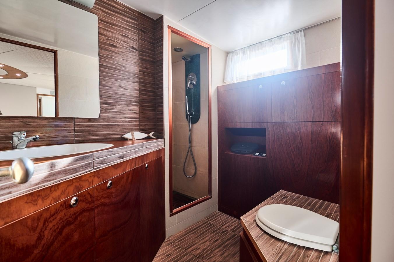 a bathroom with a sink and a mirror aboard PRINCESS SOFIA Yacht for Sale