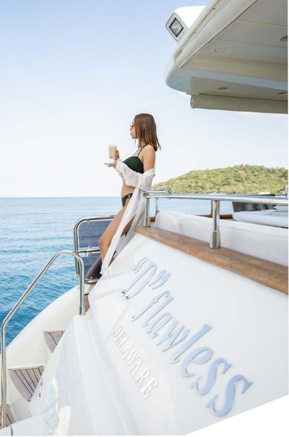 a person sitting on a boat aboard D FLAWLESS Yacht for Sale