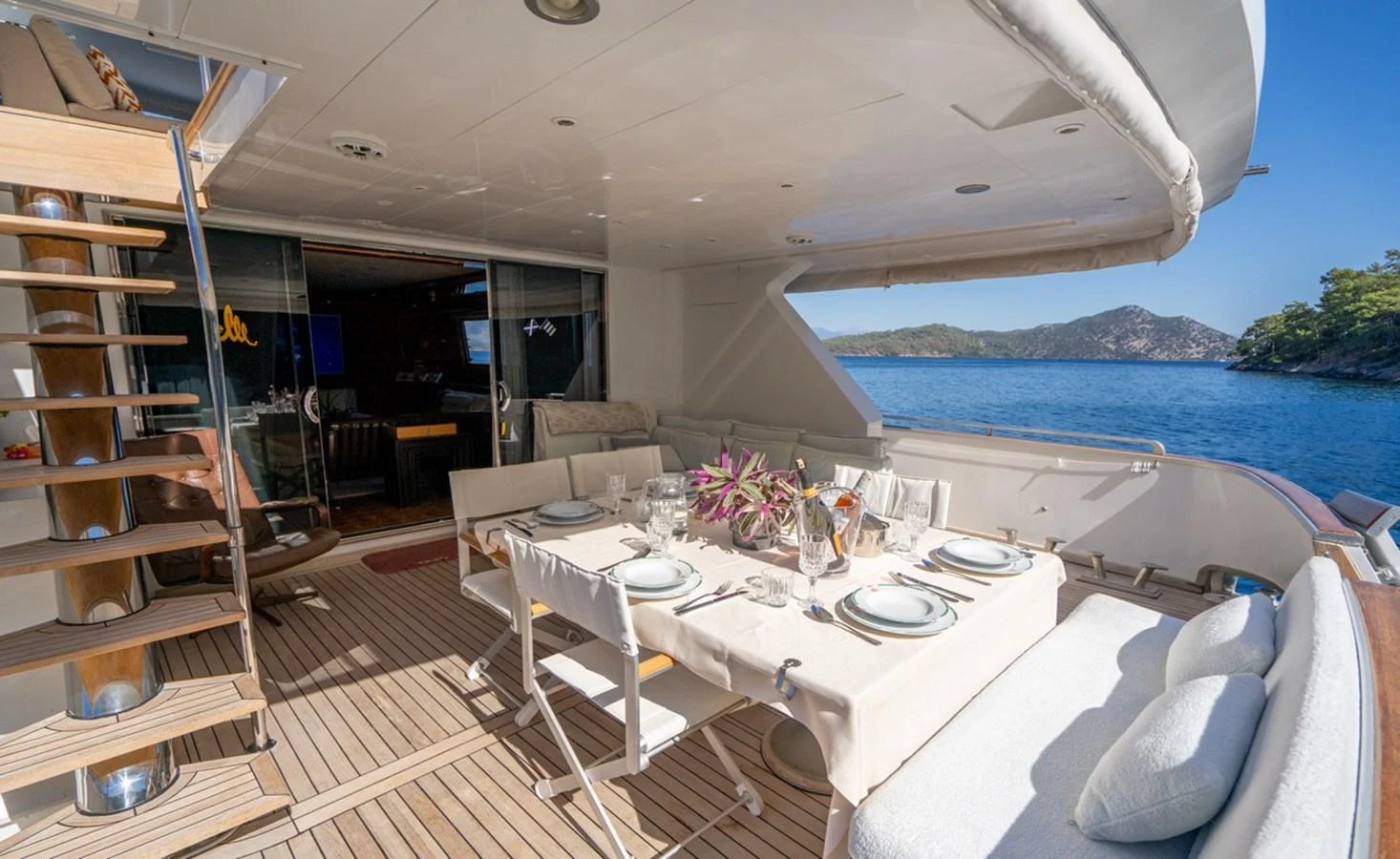 a room with a table and chairs aboard ADMIRAL 27 M Yacht for Sale