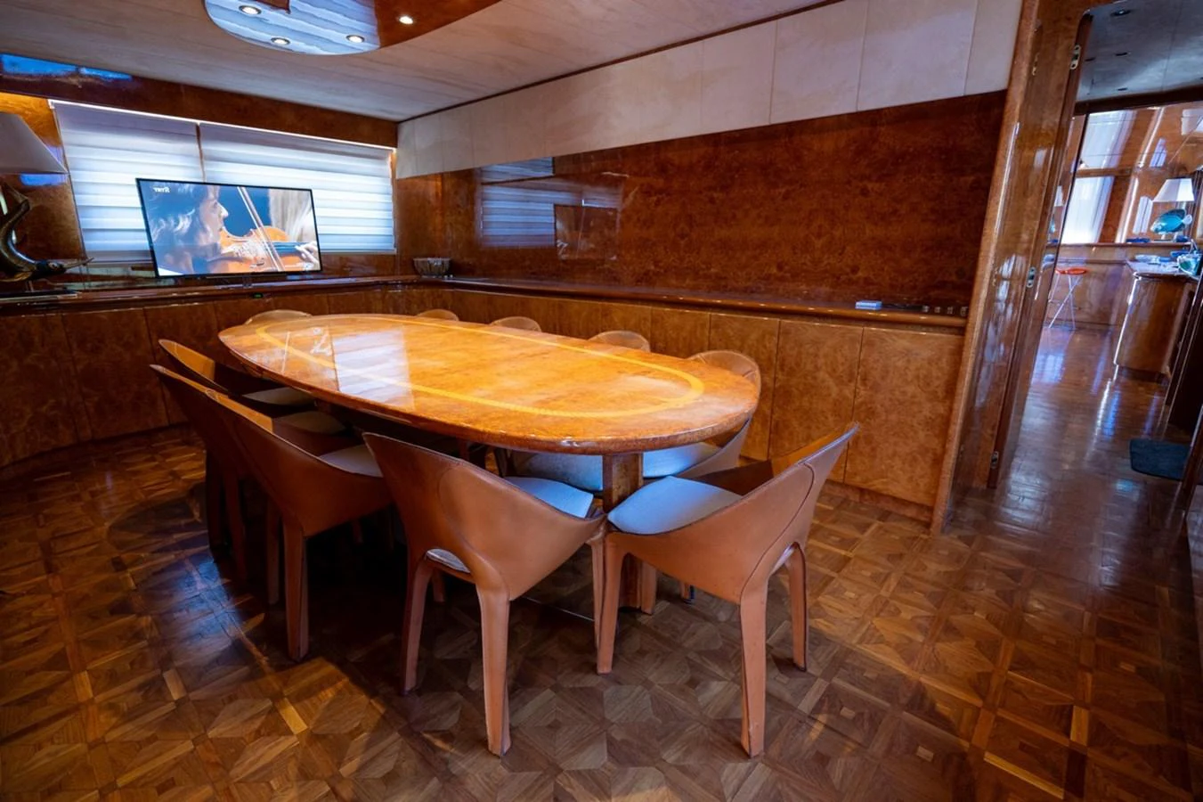 a table and chairs in a room aboard ADMIRAL 27 M Yacht for Sale