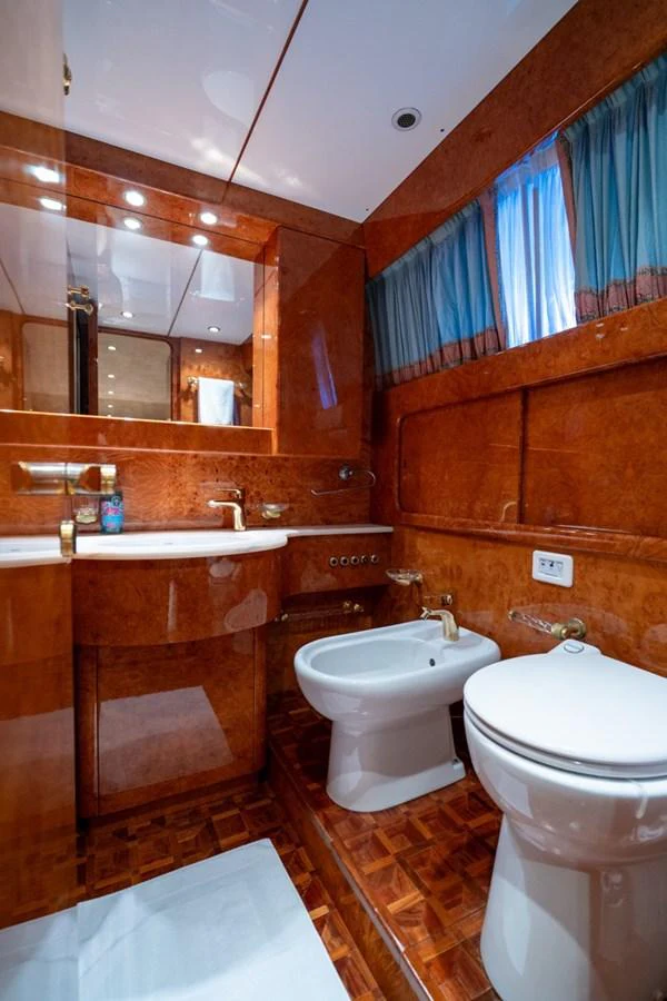 a bathroom with a sink and toilet aboard ADMIRAL 27 M Yacht for Sale