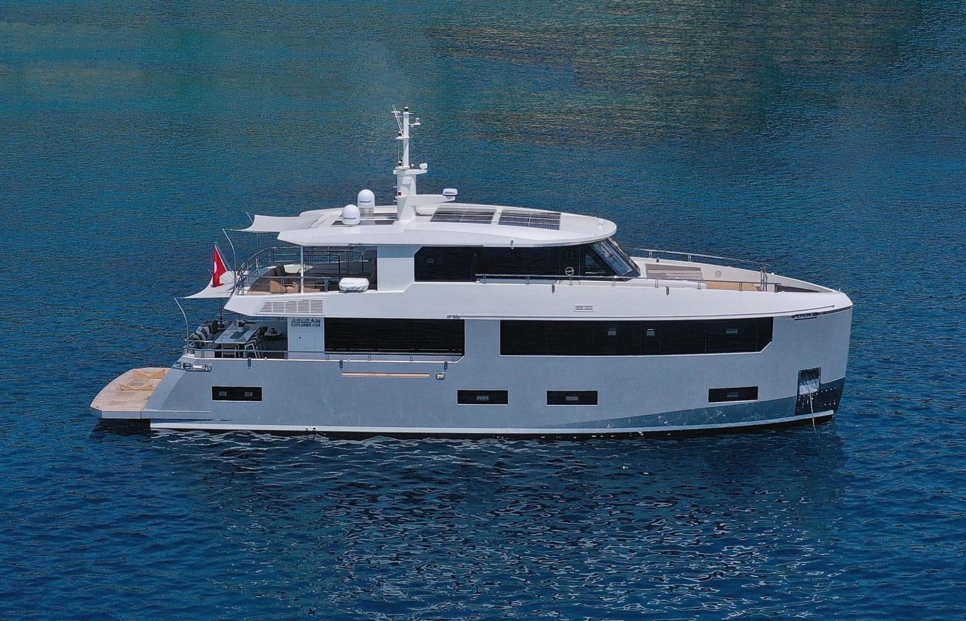 a white yacht in the water aboard TORTURA Yacht for Sale