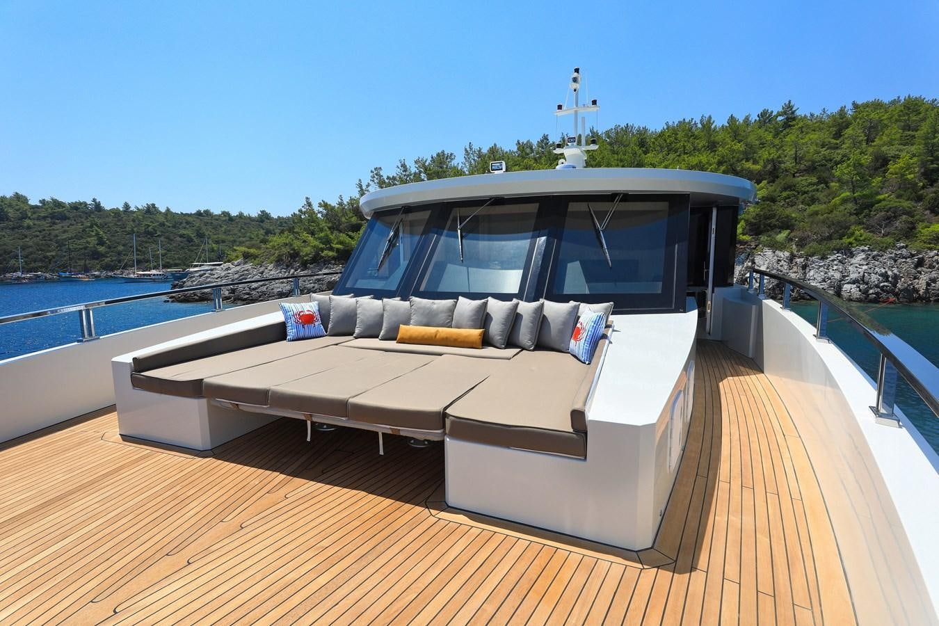 a boat on a deck aboard TORTURA Yacht for Sale