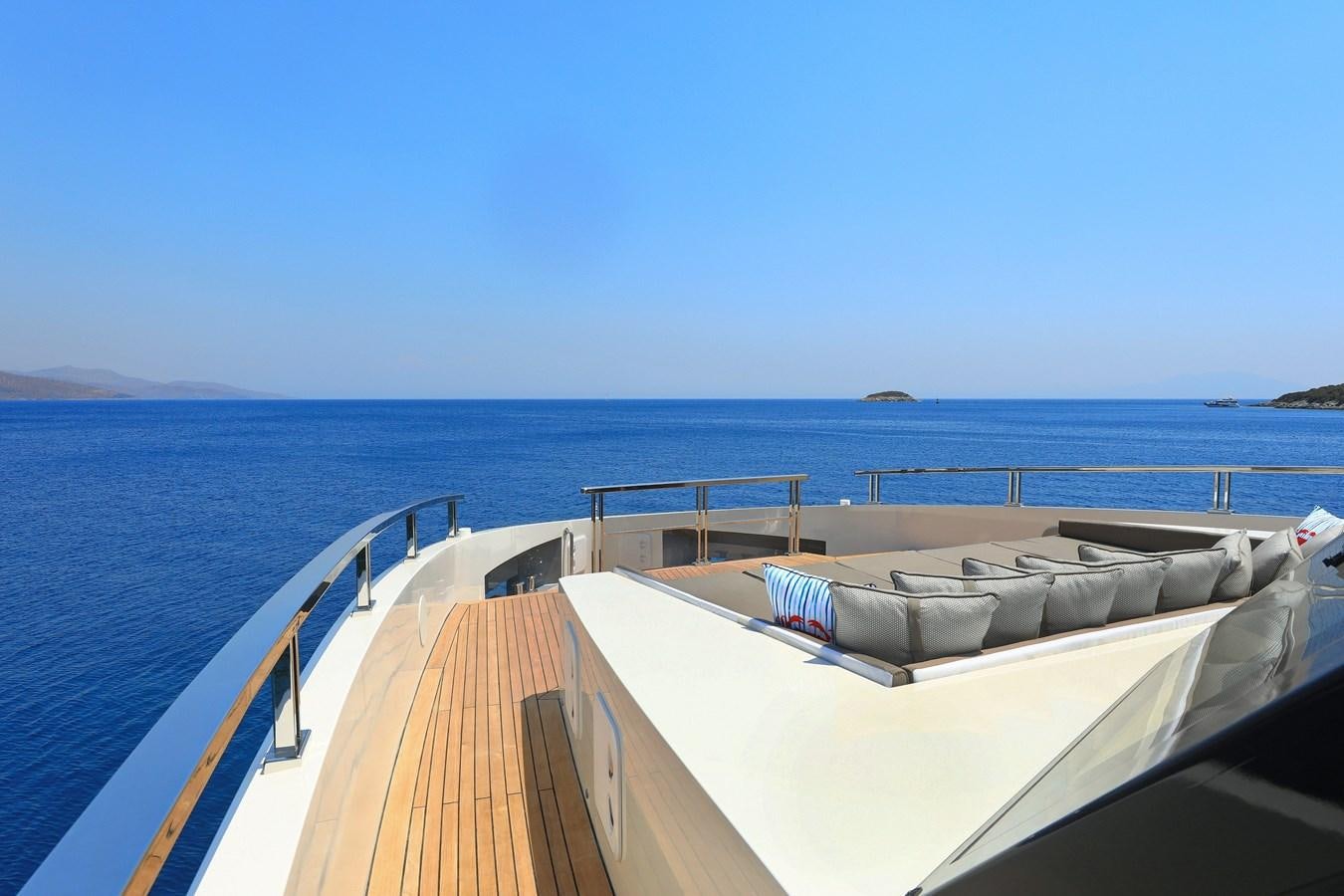 a deck with a mattress on it by the water aboard TORTURA Yacht for Sale