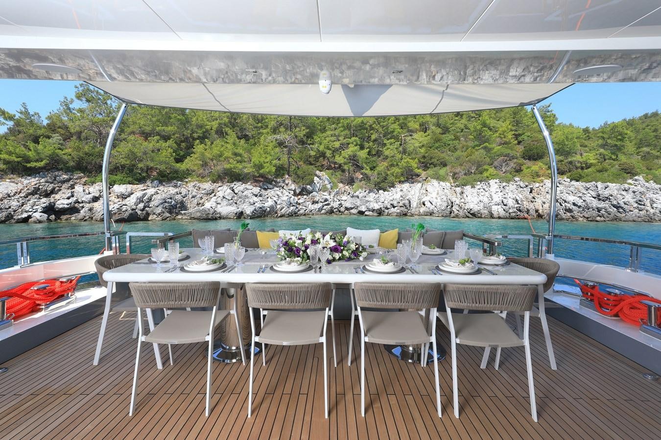 a table set up on a deck aboard TORTURA Yacht for Sale