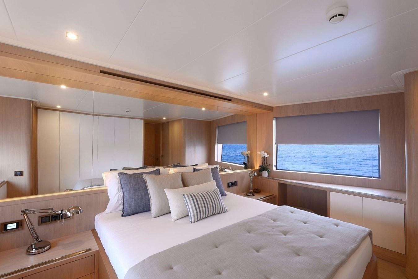 a room with a bed and a window aboard TORTURA Yacht for Sale