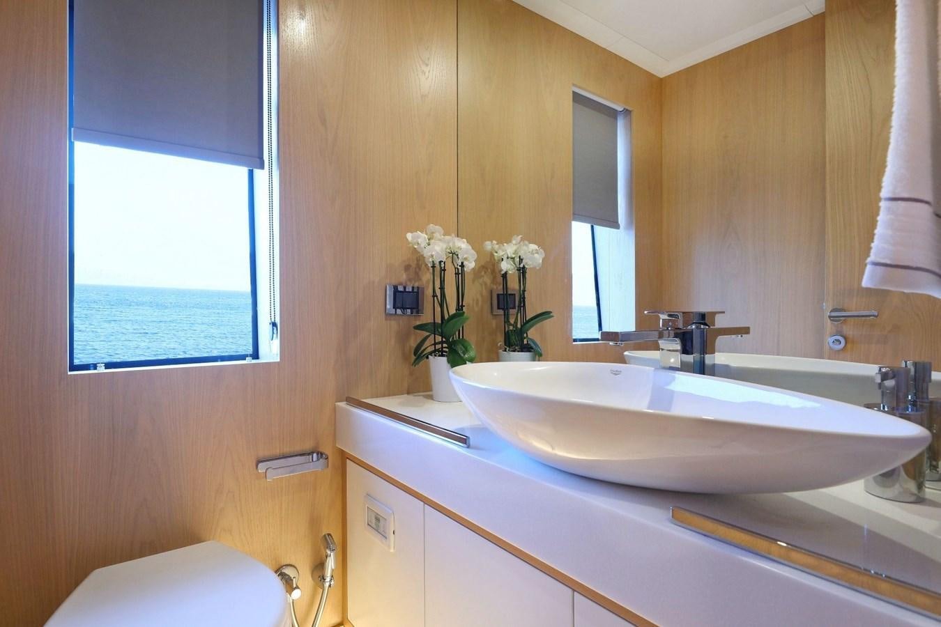 a bathroom with a sink and a toilet aboard TORTURA Yacht for Sale