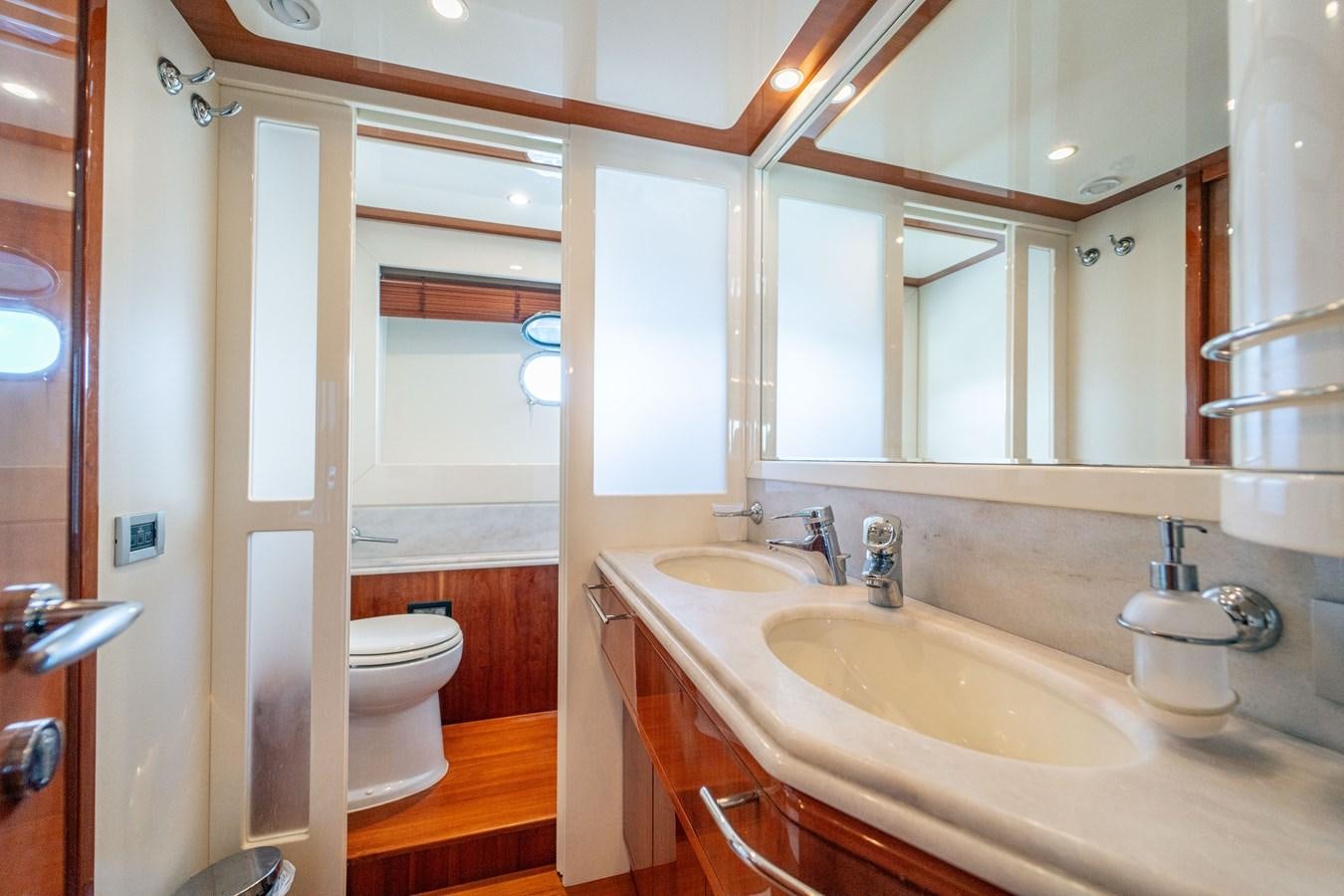 a bathroom with a sink and a toilet aboard LADY HELENA Yacht for Sale