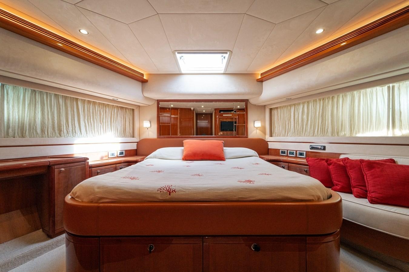 a room with a bed and a couch aboard LADY HELENA Yacht for Sale