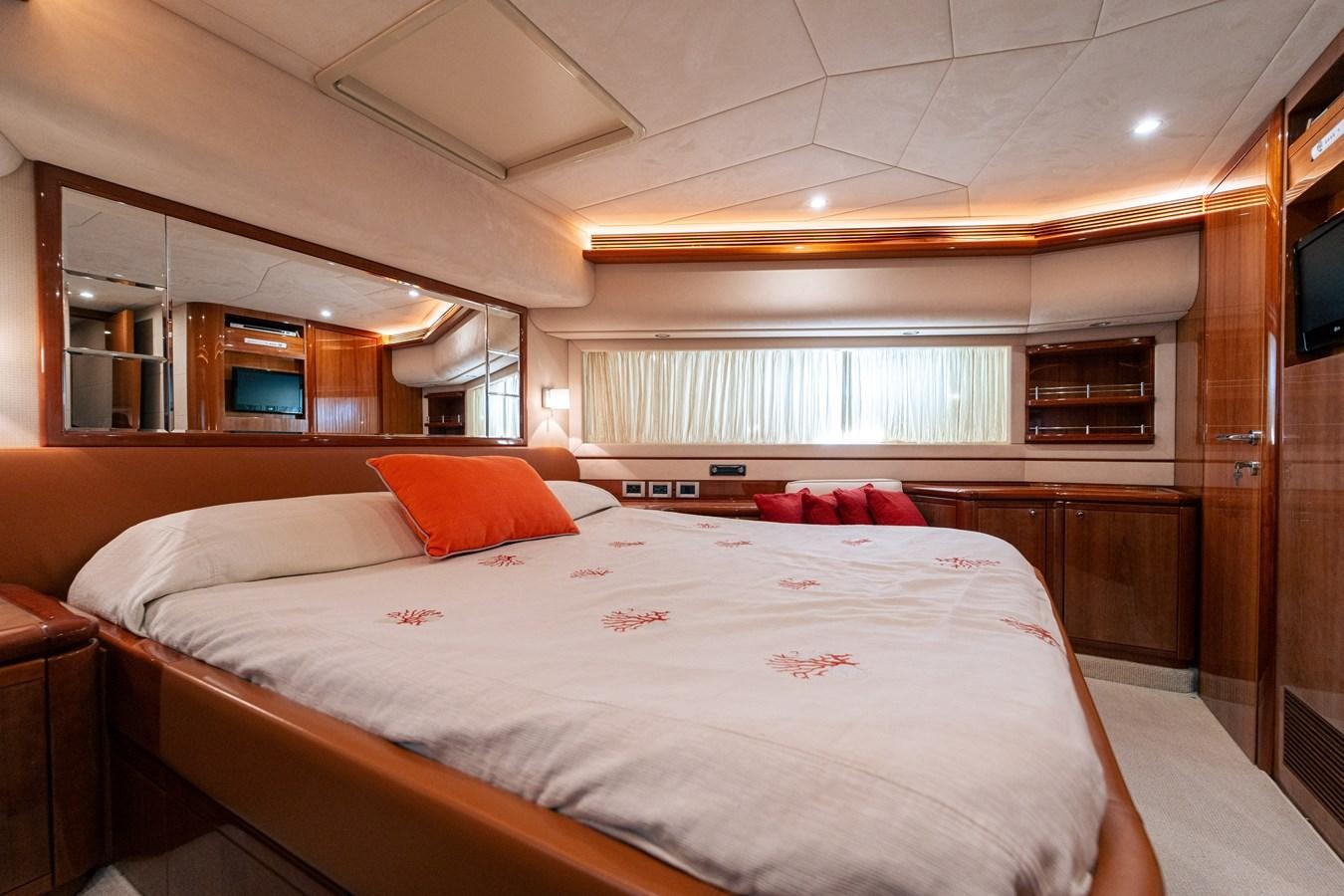 a bed with white sheets aboard LADY HELENA Yacht for Sale