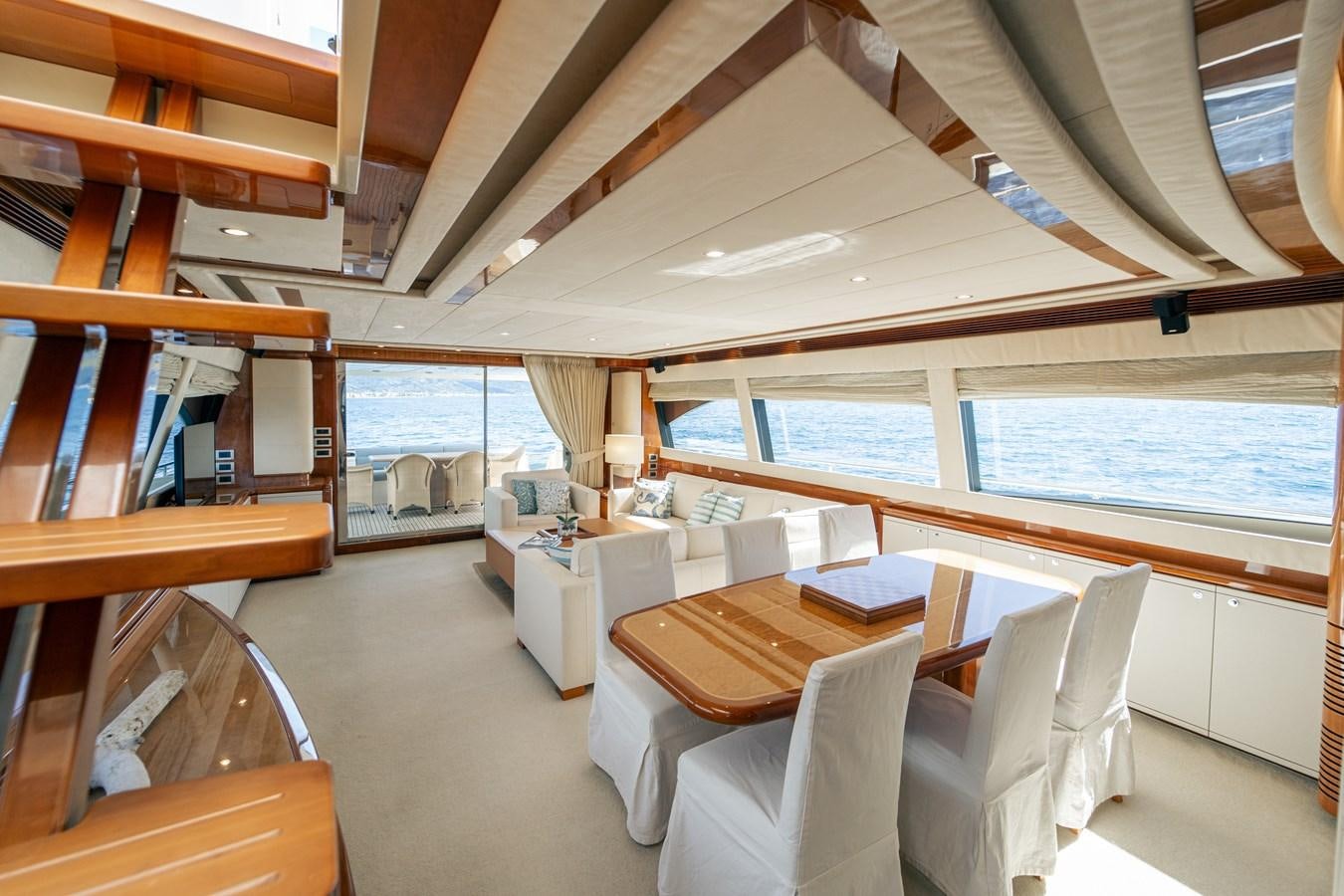 a room with a table and chairs aboard LADY HELENA Yacht for Sale