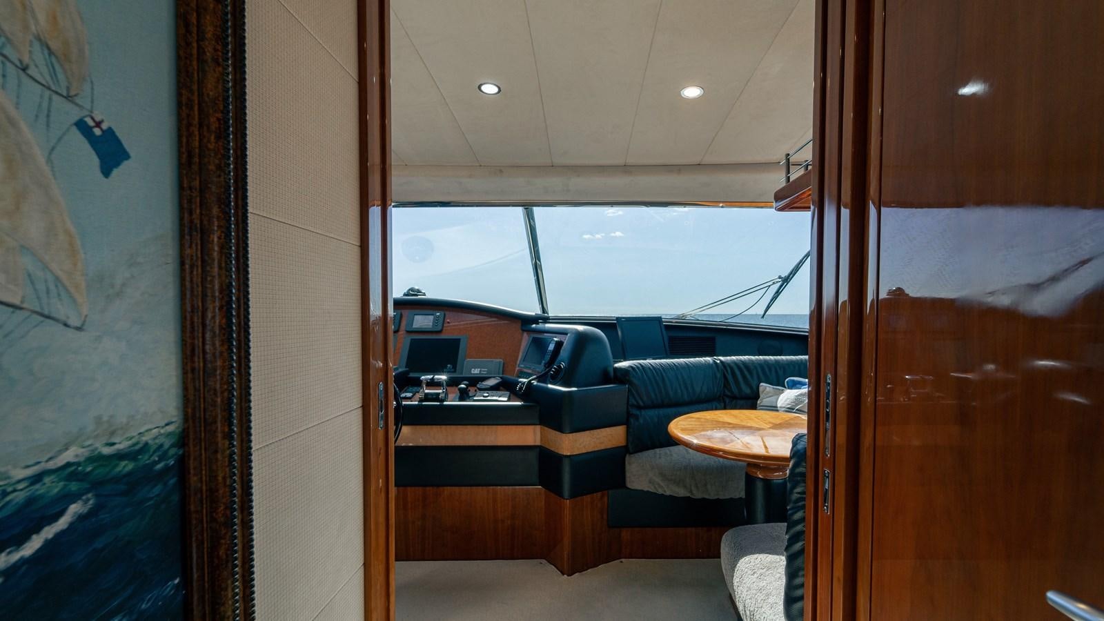 a room with a desk and a window aboard LADY HELENA Yacht for Sale